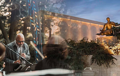 A blended image showing a musician playing saxophone outdoors and a sunset view of Lincoln’s Sculpture Garden featuring a bronze statue.