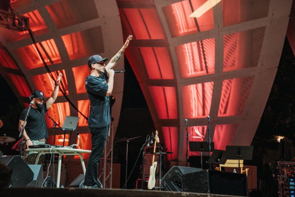 Mic Jordan performs in Omaha at the 2024 Nebraska Crossroads Music Festival with Twin City Tone