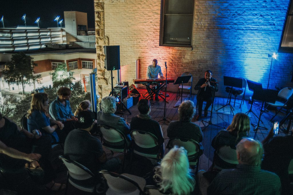 Emmanuel Hovhannisyan and Vardan Ovsepian perform on the rooftop of Kiechel Art Gallery at the 2024 Nebraska Crossroads Music Festival