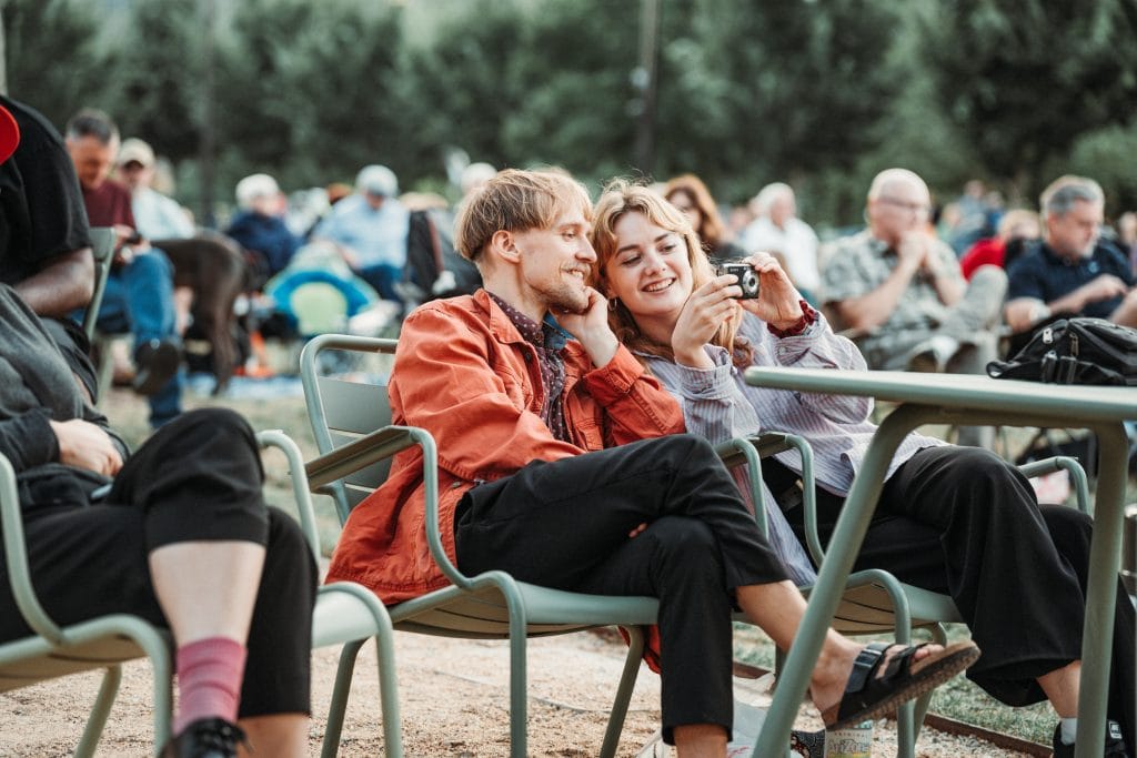 Audience members enjoy the relaxing atmosphere at the Omaha Showcase at Gene Leahy Mall in 2024