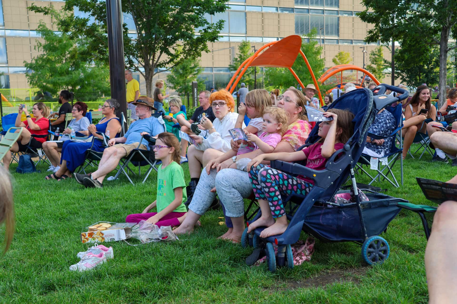 Families sit in lawnchairs at the Gene Leahy Mall.