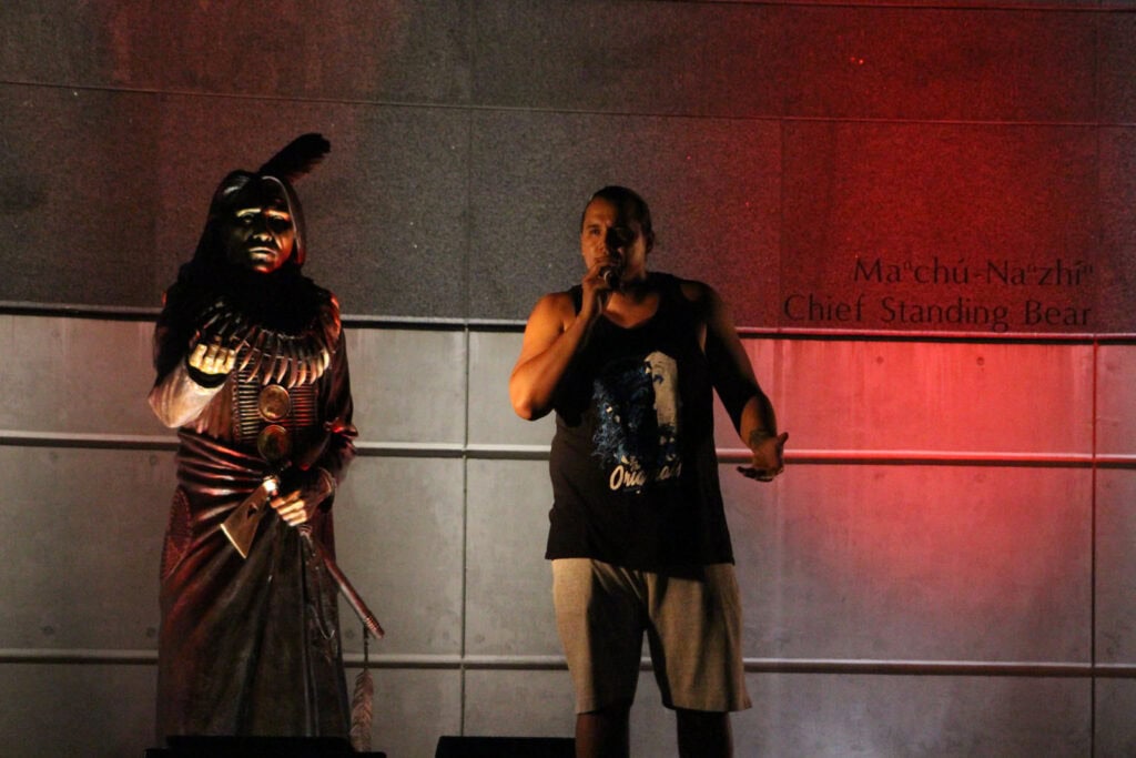 2019-Centennial Mall-Tall-Paul-performance-next-to-Standing-Bear-Statue